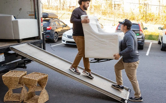 Trained specialists securely packing and loading items to ensure safe and damage-free transport.